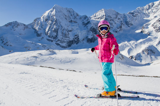 Skiing, ski holiday - kid on mountainside