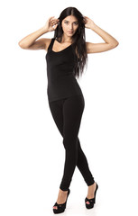 Fototapeta premium Beautiful young woman standing over white