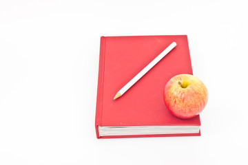 An apple on book