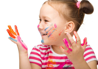 Obraz premium Portrait of a cute girl with painted hands
