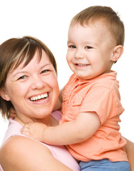 Portrait of a happy mother hugging her son