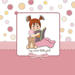 sweet little girl reading a book