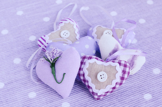 Decorative lavender hearts on lavender background