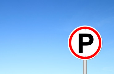 Parking sign over blue sky