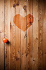 Wooden door with red heart in the middle
