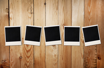 Old photos on a wooden background