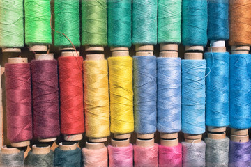 Colorful bobbins of thread as backgrou