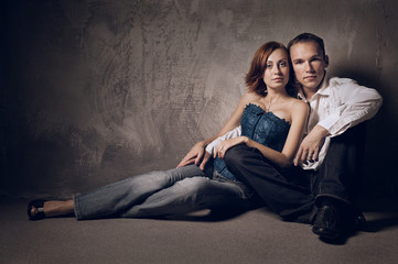 Beautiful young couple in love indoor, studio shot