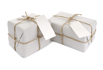 Parcels wrapped with  paper, tied with string