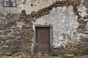Old stone wall with door