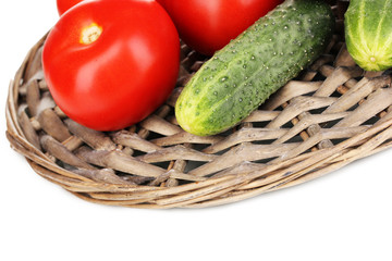 Ripe cucumbers and tomatoes isolated on white