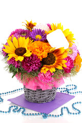 Beautiful bouquet of bright flowers with paper note isolated