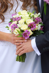Obraz na płótnie Canvas Couple with wedding bouquet