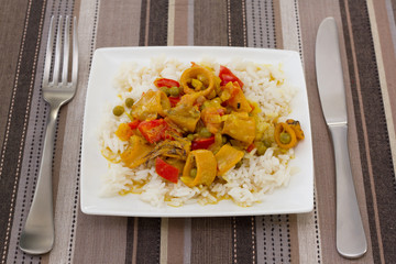 squid with peas and pepper in curry sauce with boiled rice