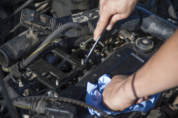 mechanic repairs a car