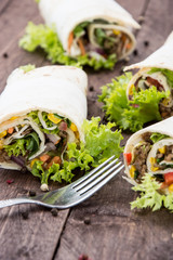 Wraps on wooden background