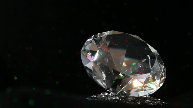 single sparkling diamond, turning