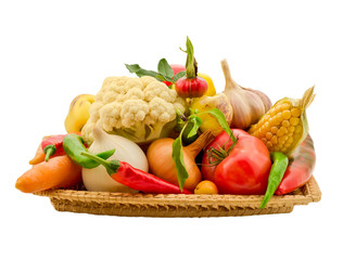 composition of vegetables in a basket isolated on white backgrou