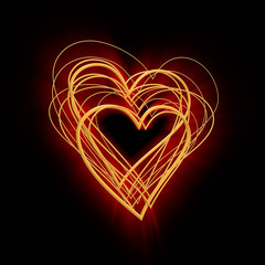 abstract glowing heart of gold on a black background