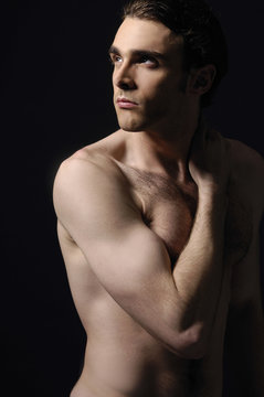 Portrait of a handsome muscular young man. Shot in a studio.