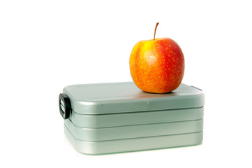 a lunchbox and an apple