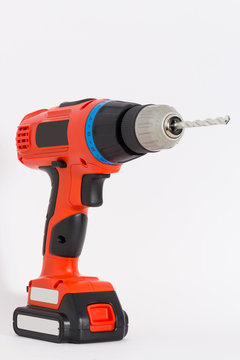 Cordless drill isolated  with bit for wall