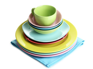 Colorful plates on napkin isolated on white