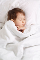 Pretty girl lying on bed at home