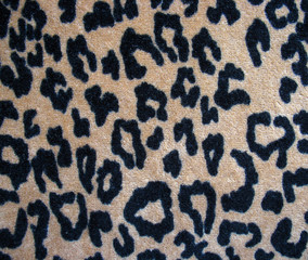 Fleecy brown leopard skin fabric background