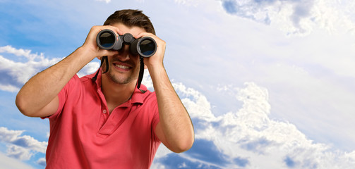 Man Looking Through Binocular