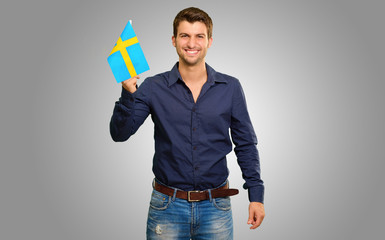 Portrait of a man holding flag