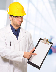 Technician Holding Writing Pad