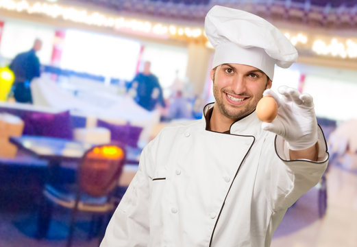 Male Chef Holding A Pot And Egg