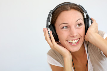 Cheerful woman with headphones, isolated