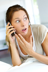 Portrait of woman receiving bad news on the phone