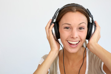 Fototapeta premium Cheerful woman with headphones, isolated