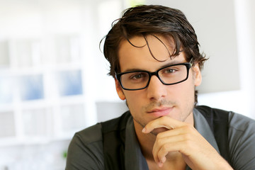 Portrait of handsome young man with glasses