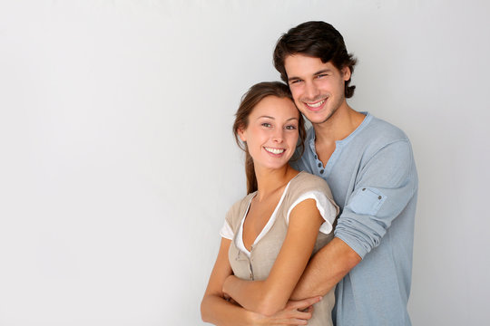 Cheerful Young Couple Standing On White Background, Isolated