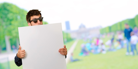 Young Man Holding Blank Paper