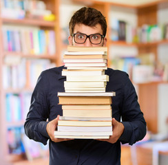 Young Man Holding Books