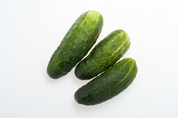 A fresh green cucumber isolated on a white background