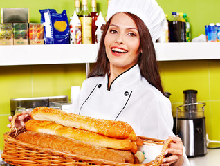 Female chef holding  food.