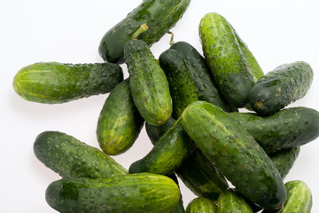 A fresh green cucumber isolated on a white background