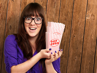 Casual Woman Holding Popcorn Container