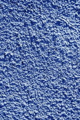 Blue painted textured walls closeup macro details.