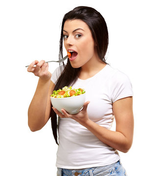 Young Girl Eating Salad From Bowl