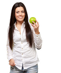 Woman showing green apple