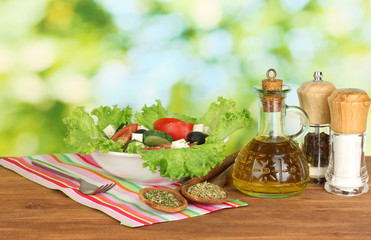 tasty greek salad on bright green background