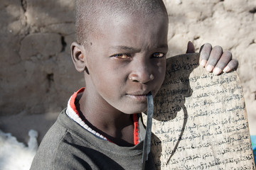 Boy showing his Arabic manuscript, Timbuktu, Mali.
