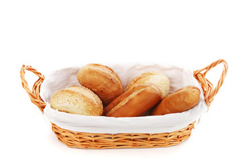 bread in wicker basket isolated on white